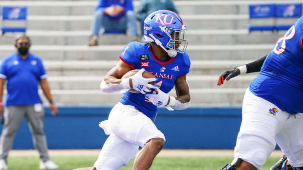 Oct 3, 2020; Lawrence, Kansas, USA; Kansas Jayhawks running back Pooka Williams Jr. (1) runs against the Oklahoma State Cowboys during the first half at David Booth Kansas Memorial Stadium. Mandatory Credit: Jay Biggerstaff-USA TODAY Sports